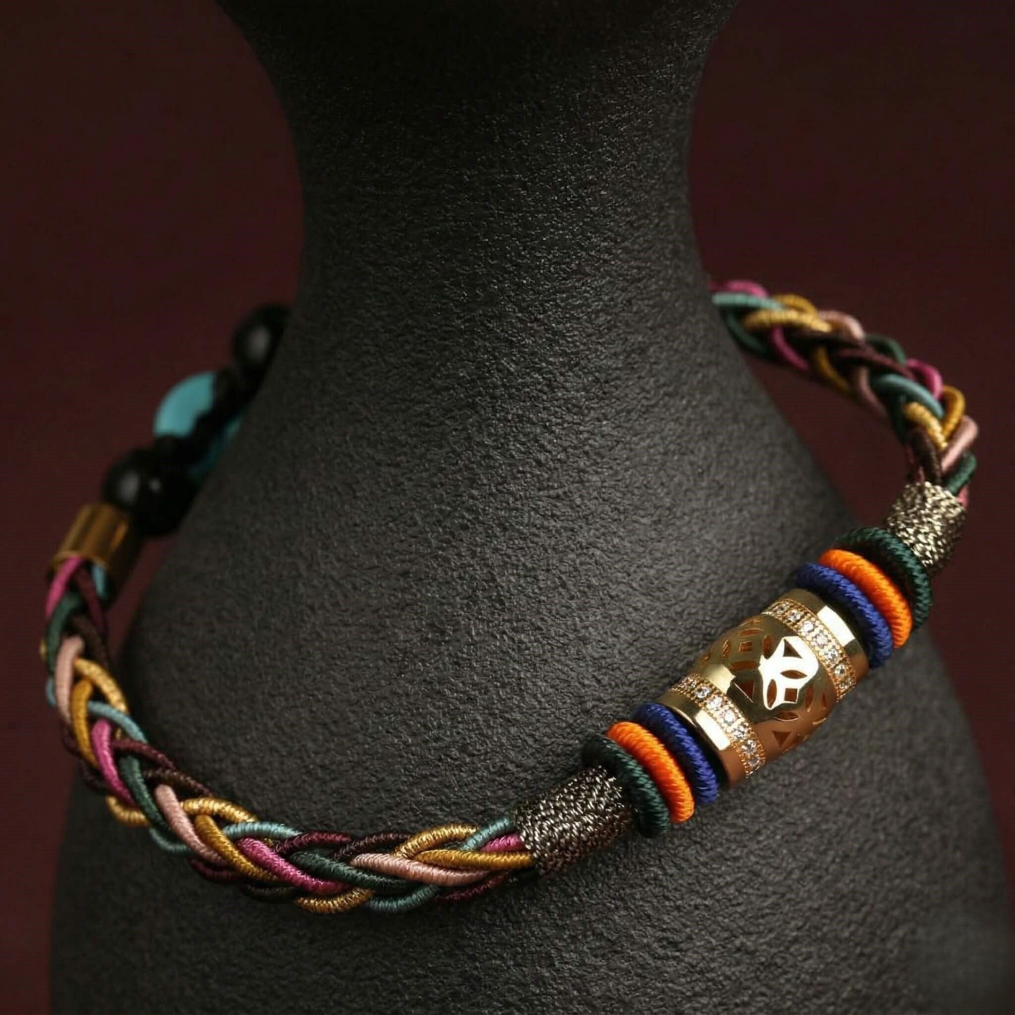 The "Infinite Peace" Bracelet for Women, Artisan-Woven Jewelry with Lucky Golden Charm - detail close-up view - Proyoo Handmade