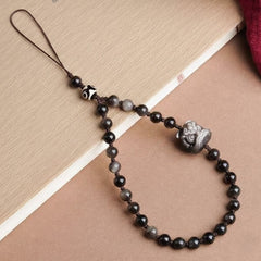 Guardian Crystal Phone Wristlet, Natural Silver Obsidian & Dzi Bead Protective Strap - lifestyle product photo - Proyoo Handmade