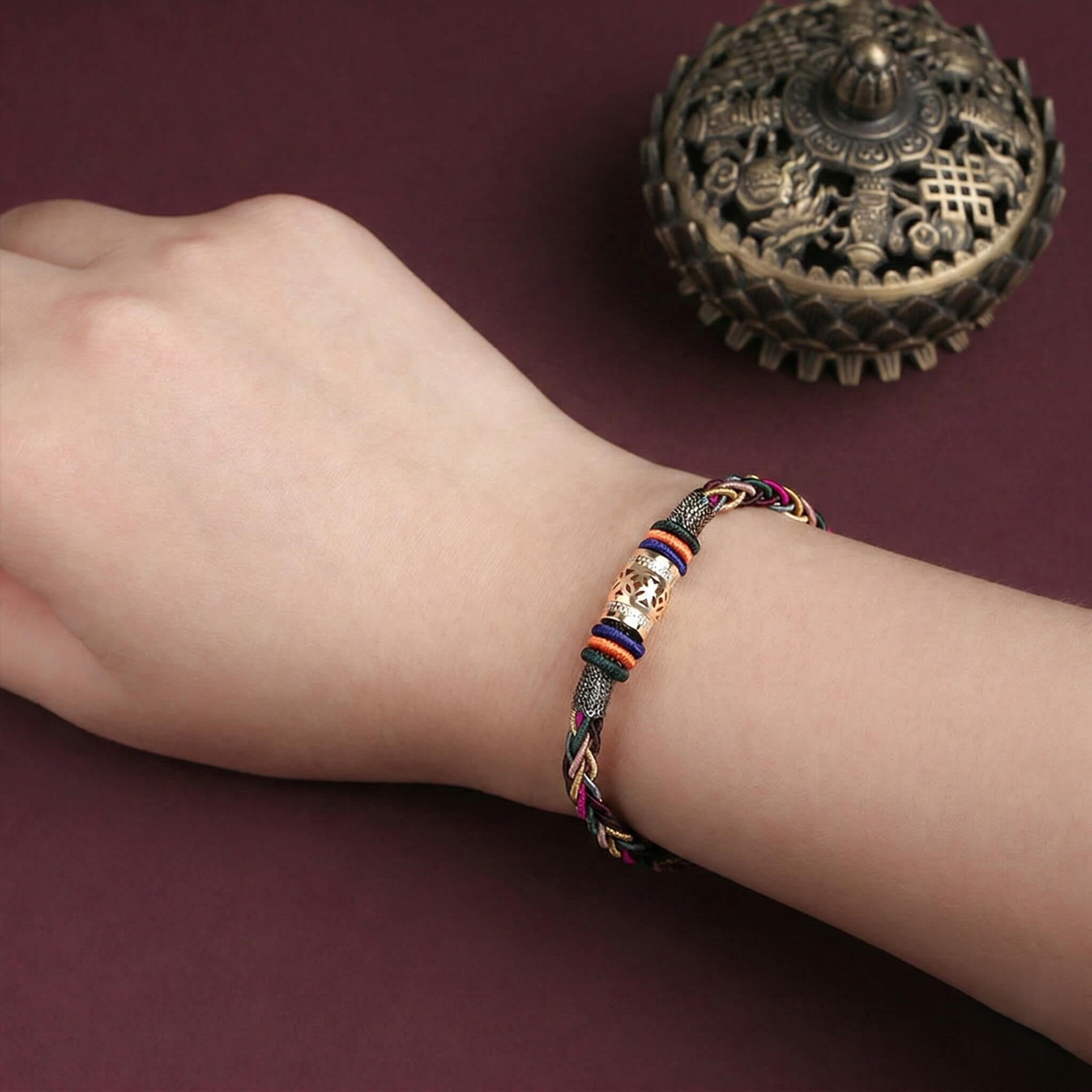 The "Infinite Peace" Bracelet for Women, Artisan-Woven Jewelry with Lucky Golden Charm - lifestyle product photo - Proyoo Handmade