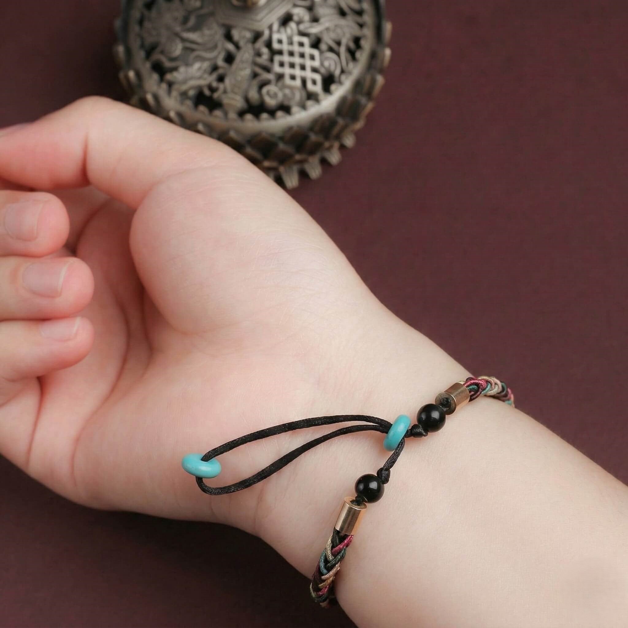 The "Infinite Peace" Bracelet for Women, Artisan-Woven Jewelry with Lucky Golden Charm - product showcase - handcrafted artisan jewelry Proyoo