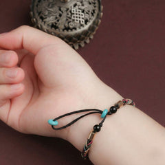 The "Infinite Peace" Bracelet for Women, Artisan-Woven Jewelry with Lucky Golden Charm - product showcase - handcrafted artisan jewelry Proyoo